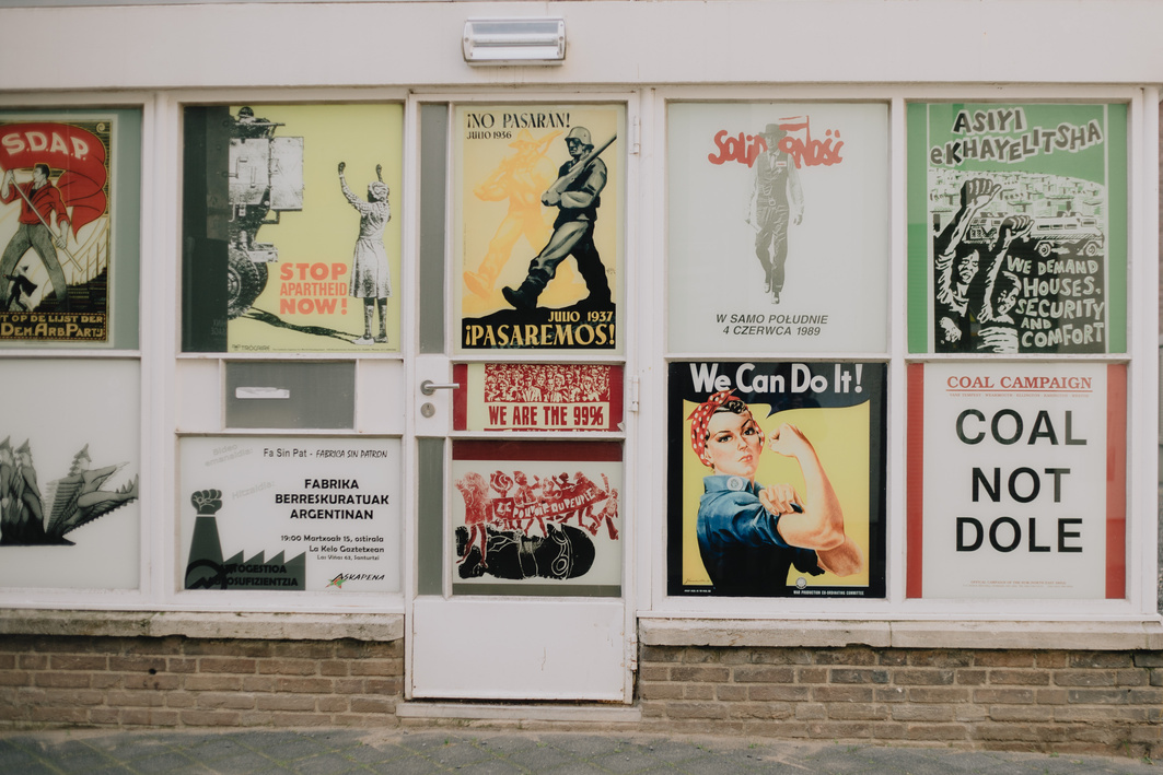 A Variety of Posters on a Storefront